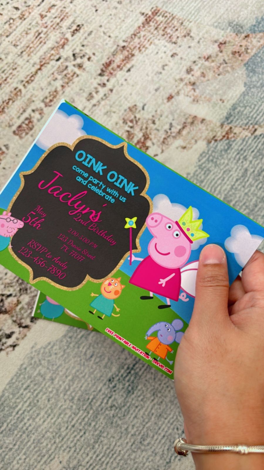Kids holding Peppa Pig birthday invitations featuring muddy puddles, bright icons, and cheerful party elements