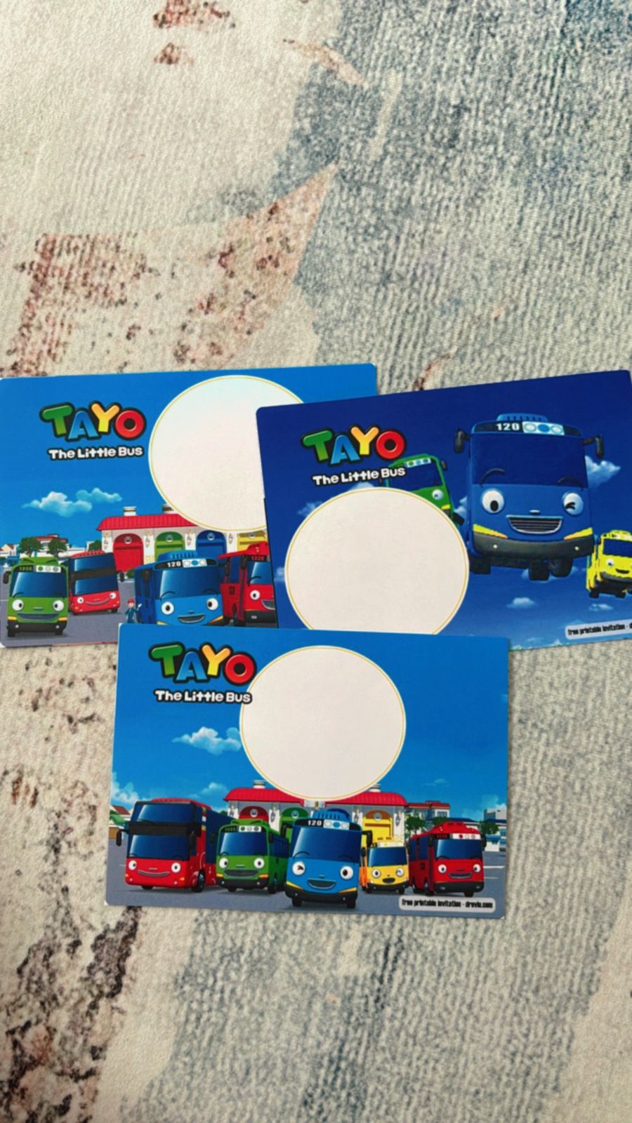Colorful Tayo themed invitation with bus lineup, street map details and bold primary colors for kids birthday party