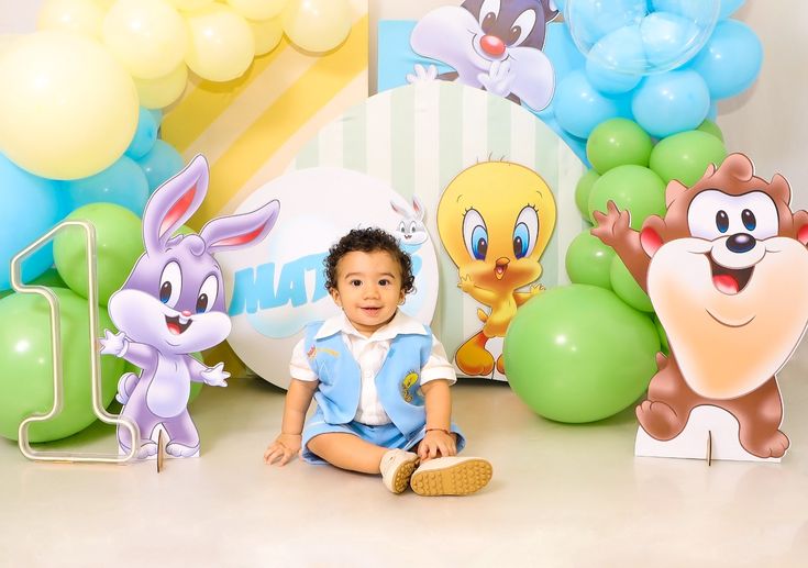 Editable Looney Tunes Invitation featuring Baby Tweety, Baby Taz, pastel balloons, clouds, confetti, and playful party icons