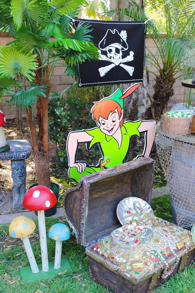 Peter Pan party invitation with Lost Boys camp, forest trees, arrows, and magical lights