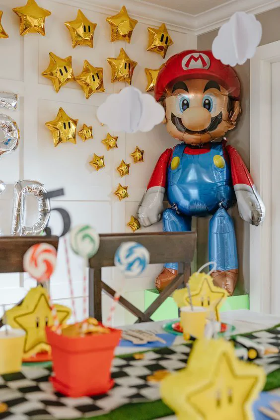 Colorful Super Mario birthday invitation template with Bowser, warp pipes, floating coins, and fire flowers