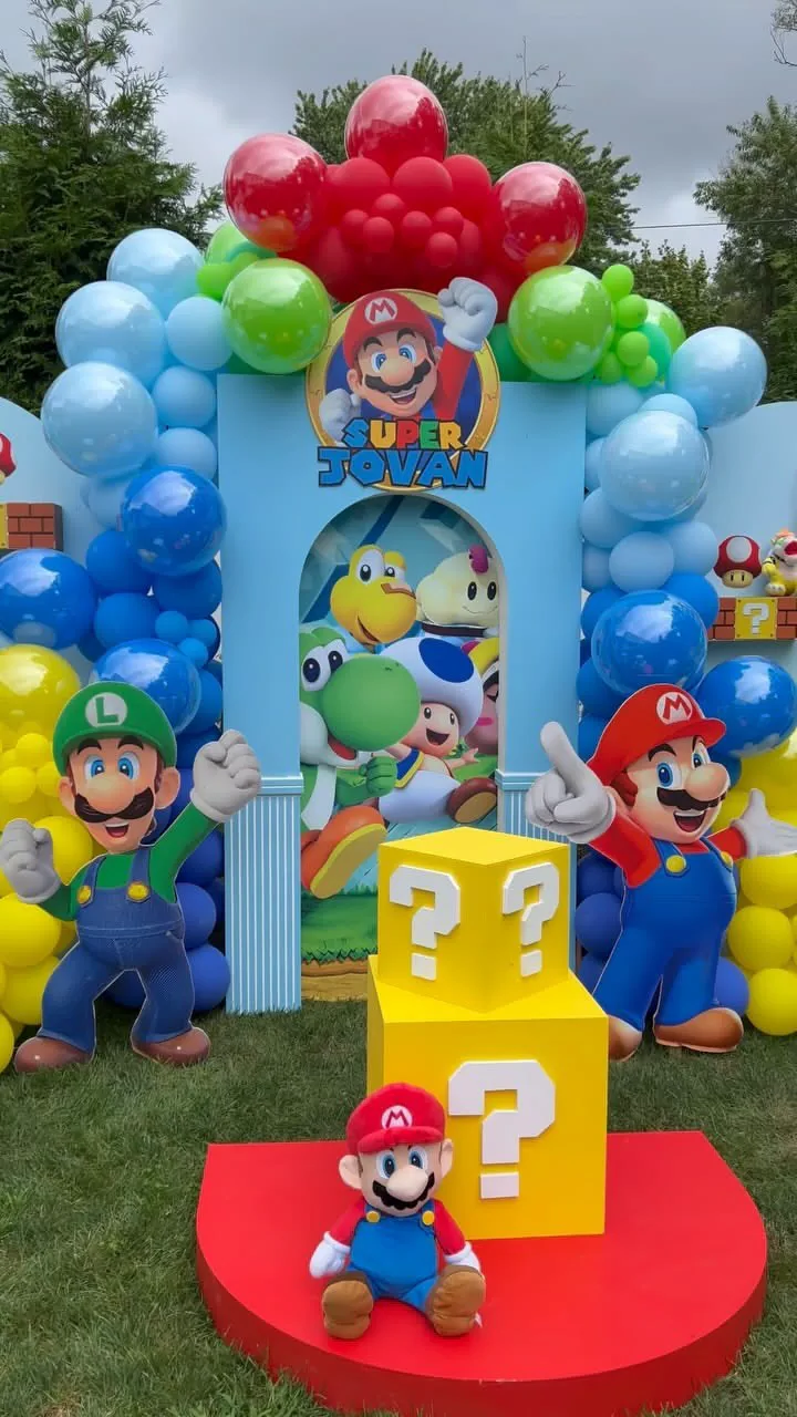 Super Mario Bros invitation with Mario, Luigi, gold coins, question blocks, and colorful game-themed background