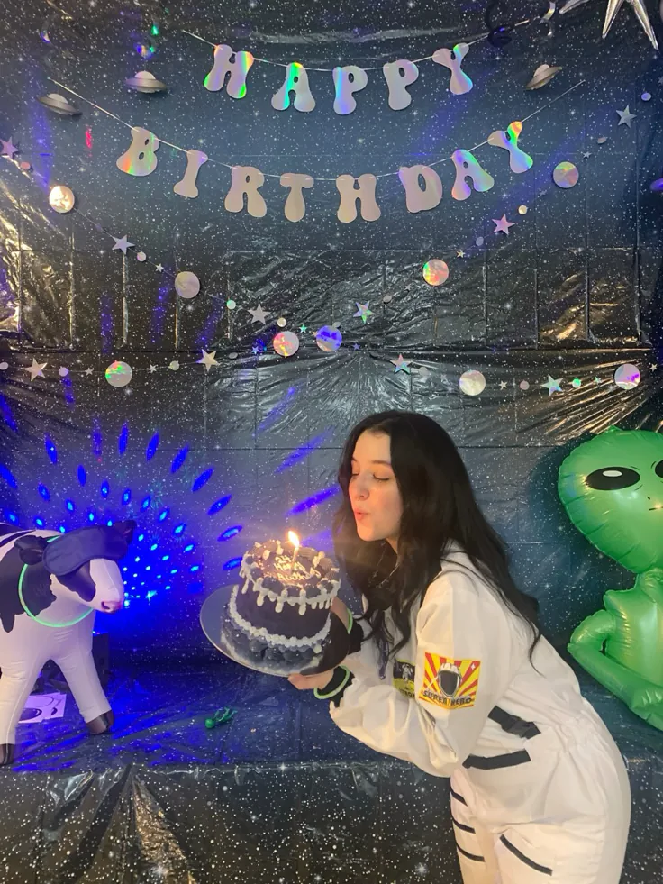 Space Ghost themed birthday invitation with galaxy sky, glowing planets, superhero ghost illustration, colorful stars, and fun kid-friendly space elements