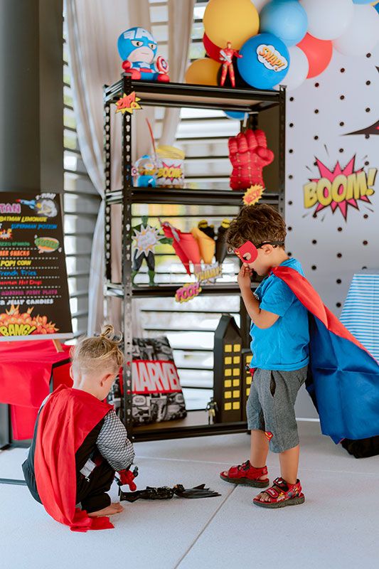 Marvel superhero themed birthday invitation featuring Avengers-inspired elements, hero symbols, colorful backgrounds, and editable party information