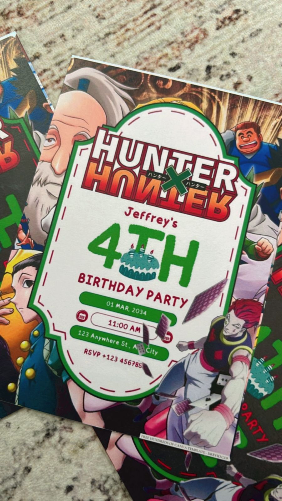 Close-up of Hunter x Hunter invitation design with forest green colors and icons