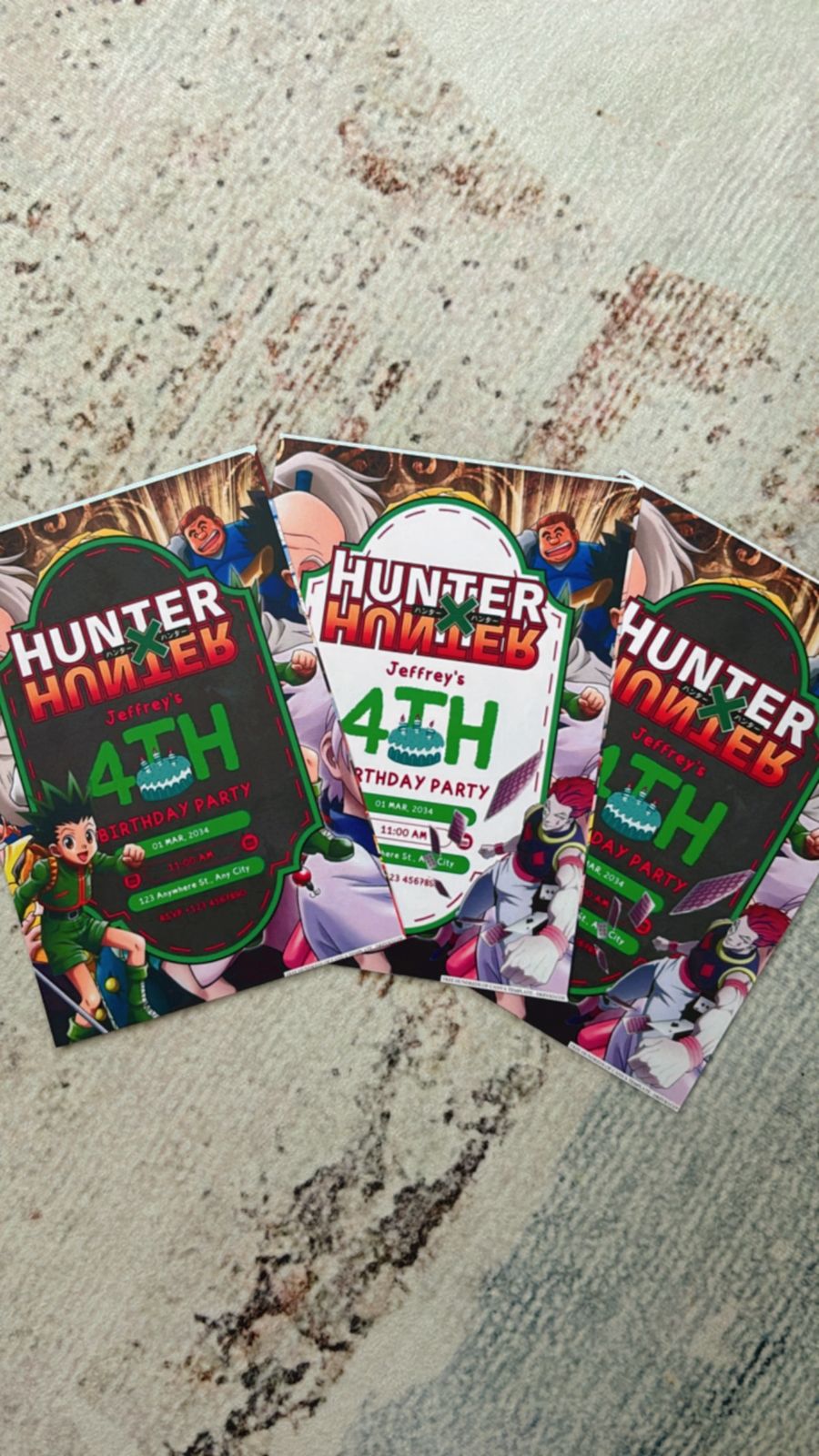 Kid holding Hunter x Hunter themed birthday invite with Killua illustration