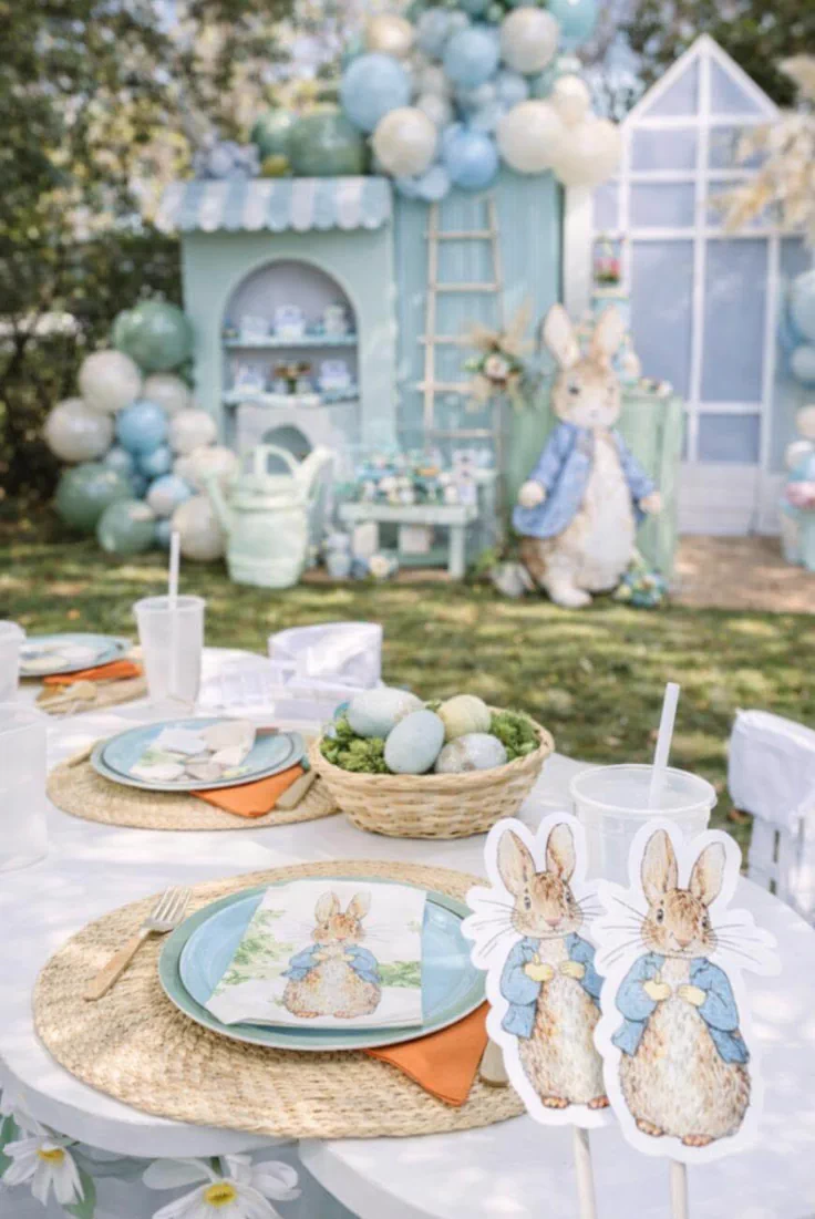 Cute Peter Rabbit Canva invitation with woodland animals, butterflies, carrots, and watercolor florals.