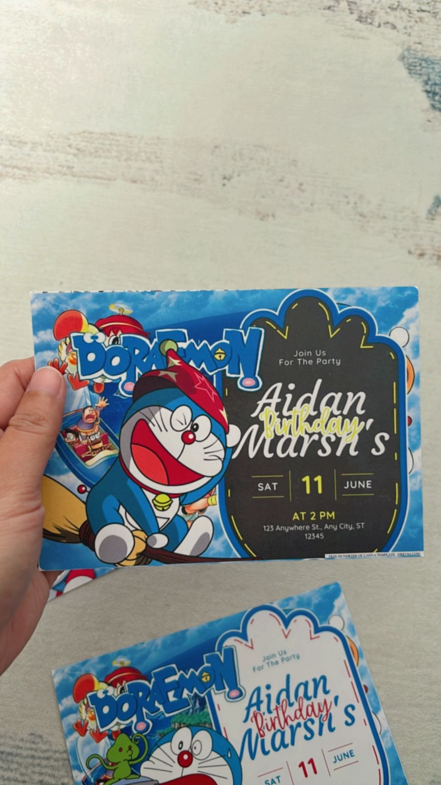 Comic-style Doraemon invitation with manga panels, bold outlines, and animated gadget details