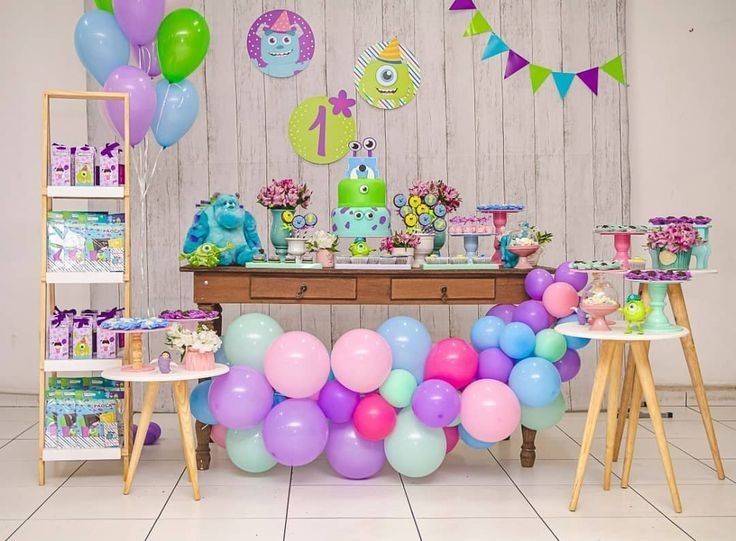 Mike Wazowski themed birthday invitation surrounded by monster eyes, green accents, doors, balloons, and confetti