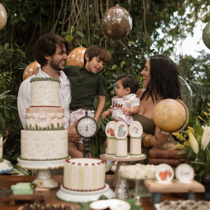 Wild Tarzan birthday invitation surrounded by banana leaves, jungle vines, and rainforest animals