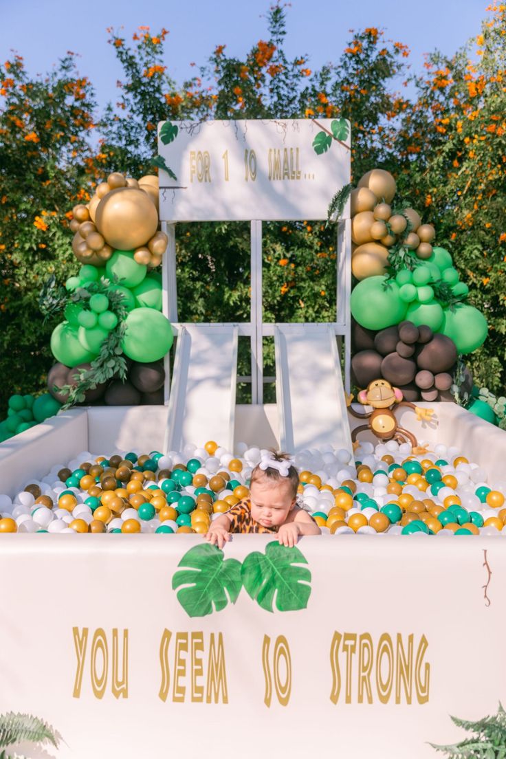 Cute Tarzan invitation template with smiling monkeys, toucans, vines, and tropical plants