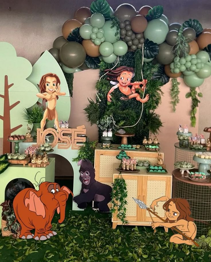 Jungle-themed Tarzan birthday invitation decorated with elephants, zebras, and lush green leaves
