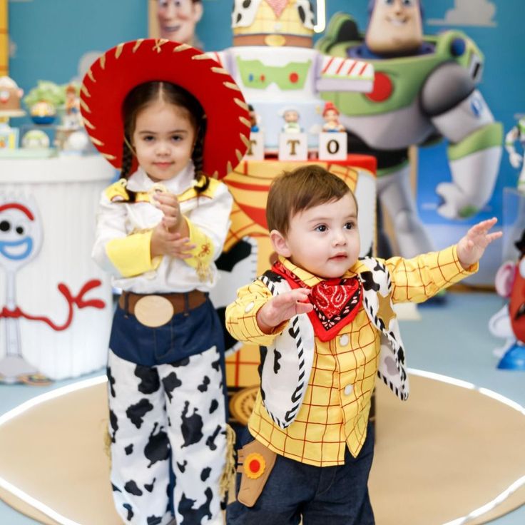 Cute Toy Story invitation decorated with little green aliens, Buzz Lightyear wings, rocket ships, sheriff stars, and clouds
