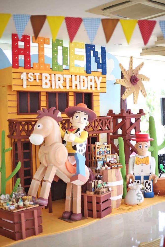 Toy Story birthday Canva template with Andy's room sky background, colorful alphabet blocks, stars, and cowboy accents