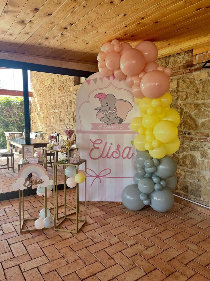 Pink Dumbo birthday invitation template with baby elephant character, floral accents, balloons, and sweet celebration elements