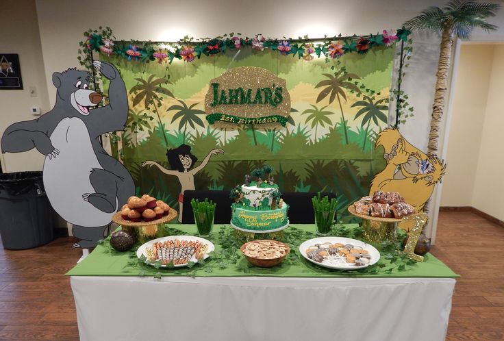 Jungle Book invitations decorated with tropical foliage, playful monkeys, warm earthy colors, and safari-inspired details
