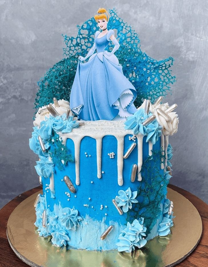 Cinderella Cake Design with frost blue icing and Cinderella topper