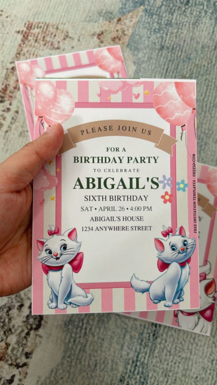 Disney Marie themed birthday invite design with paw prints, pastel pink palette, and cute cat elements