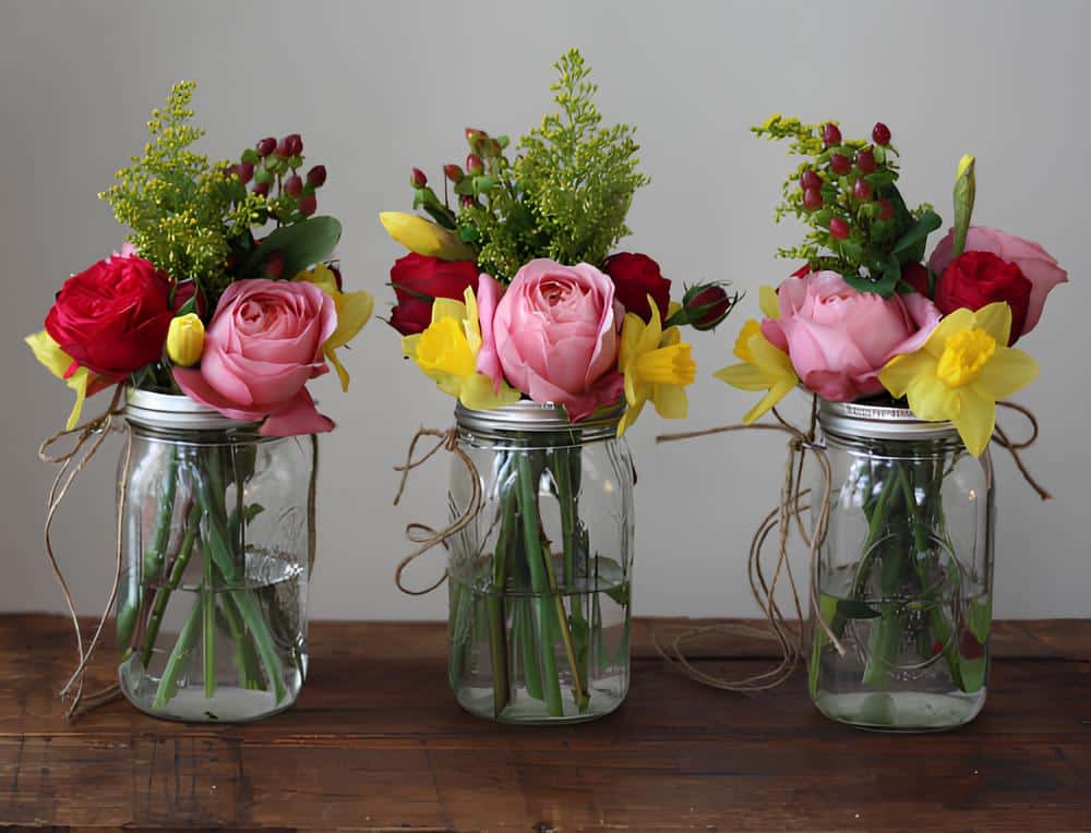 Peony and Rose flower arrangements in clear mason jar