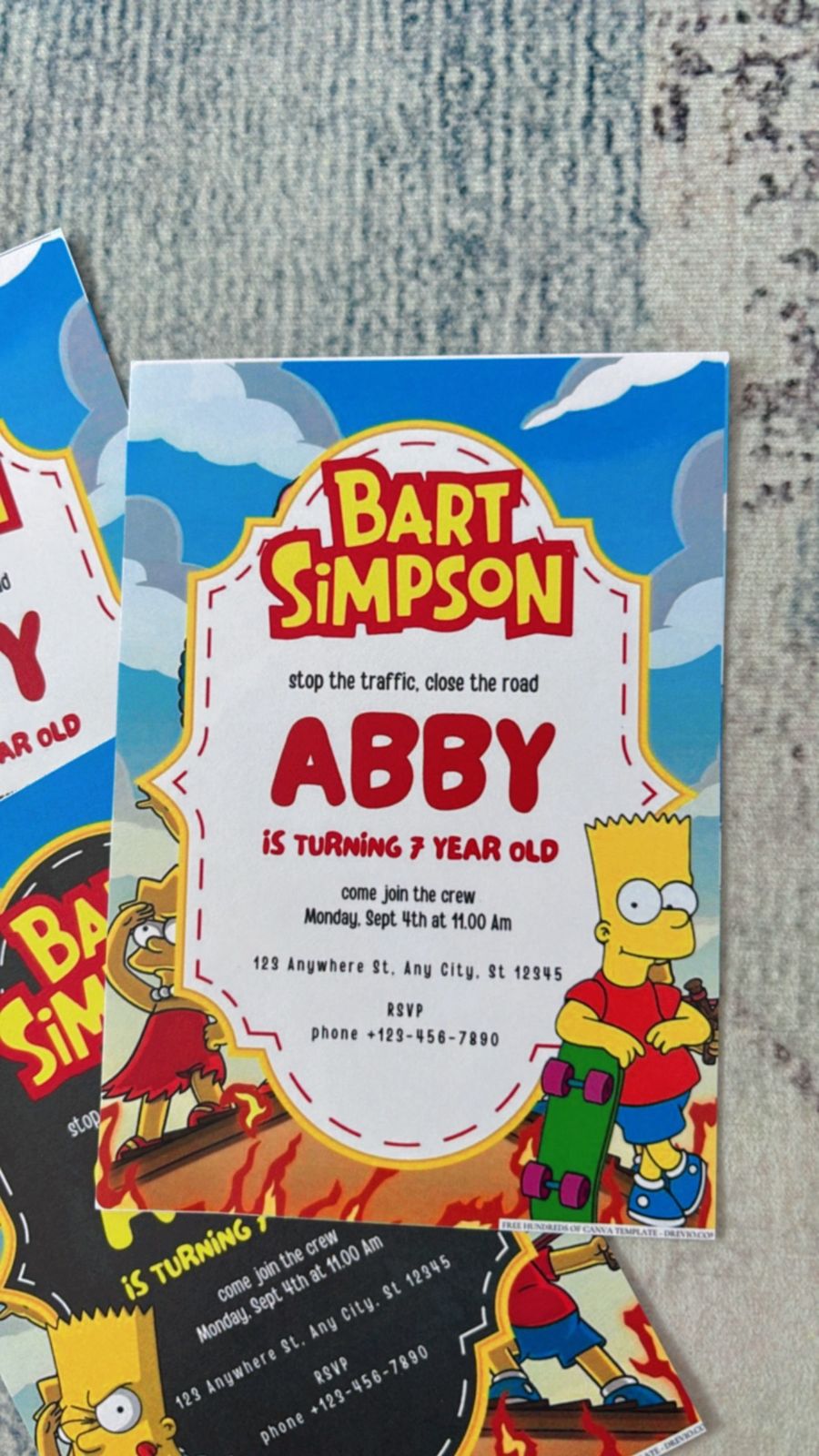 Minimal Simpsons birthday invitation with clean layout, soft clouds, and subtle Springfield-inspired details