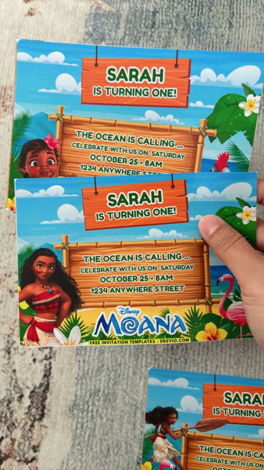 Colorful Moana birthday invitations with Polynesian patterns, floral borders, and bright tropical elements

