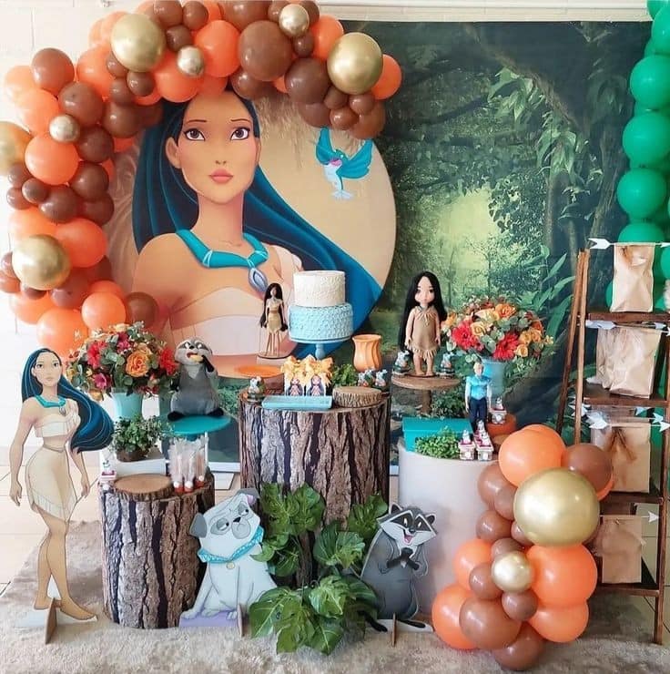 Pocahontas Party Decor Setup with Green and gold balloon arch