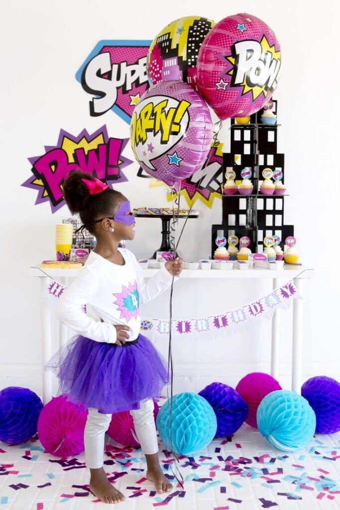 Girl Superhero themed birthday party decor with City skyscraper backdrop