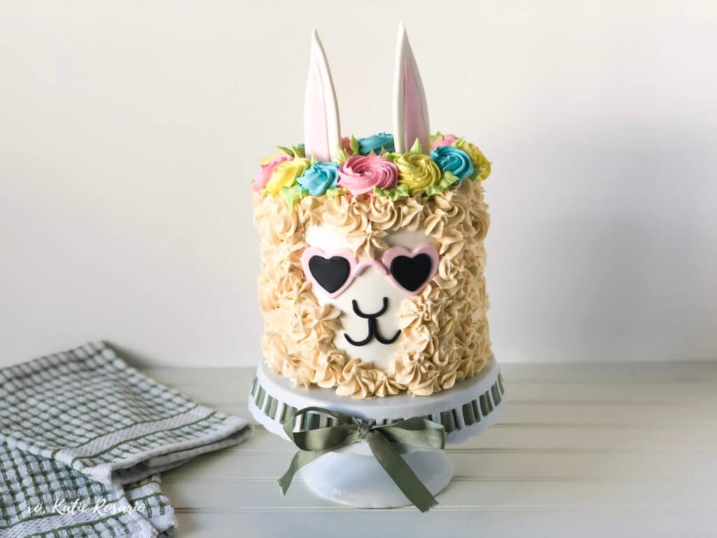 Yummy Llama birthday cake with a simple round shape cake sprinkled with colorful icing
