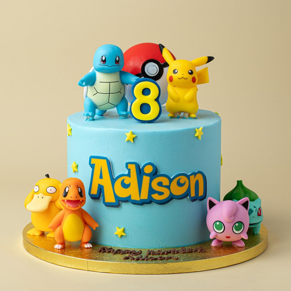 The aesthetic is clean with light blue frosting and yellow stars, and the Poké Ball topper just slaps. Adison's name is front and center, making it an absolute moment. The whole setup is a major win and perfectly captures the fun of catching 'em all.