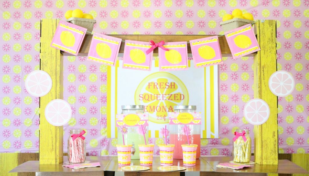 This aesthetic lemonade stand is giving major main character energy for your little one's big day. With a pink and yellow color palette that's totally on-trend and gives a nod to that Y2K vibe, this setup is a whole mood, perfect for the 'gram and making core memories without the stress. From the "Fresh Squeezed" sign and cute lemon garland to the perfectly portioned pink drinks, it's a serve, ensuring the party is a success and the pics are fire.