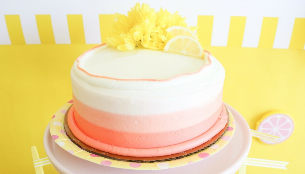 a simple round Pink Lemonade First Birthday cake