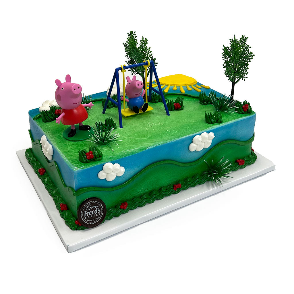 This cake is giving main character energy for any little one's birthday, with Peppa Pig and George living their best life on a swing set. It's a whole vibe, featuring a lush green and blue aesthetic that makes the playground scene totally pop, ensuring the birthday kid slays their celebration with this iconic setup.