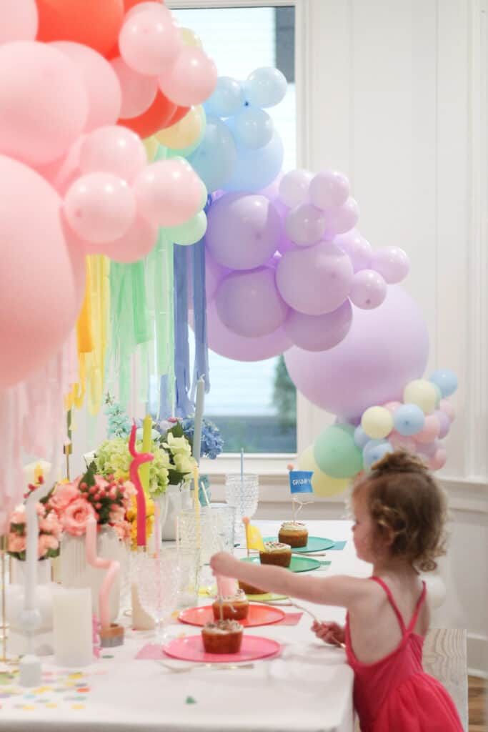 Free Care Bears birthday invitation featuring Friendship Bear, rainbow, cloud border, sunshine, and confetti elements