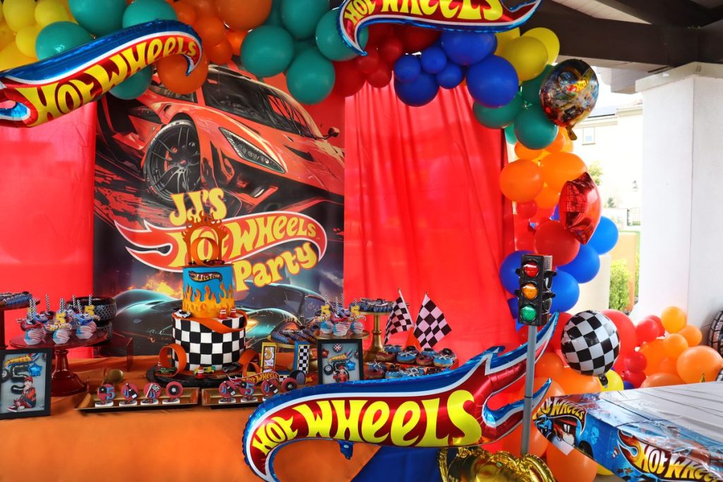 Awesome Hot Wheels Birthday party Decor with Hot Wheels Logo and McLaren Backdrop